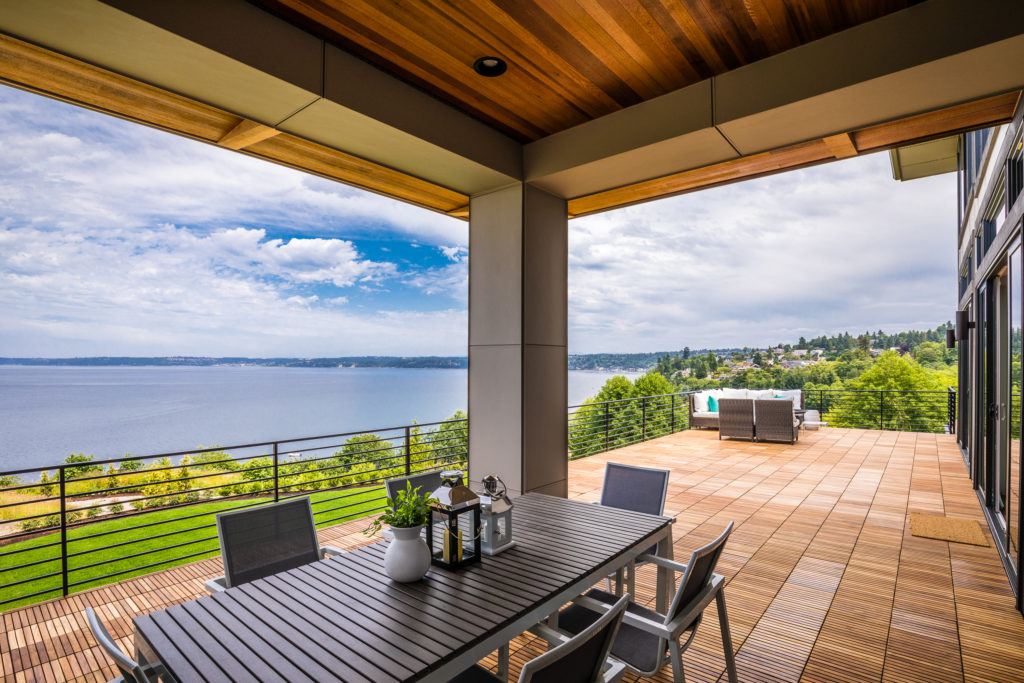 Luxury custom deck with outdoor seating and waterfront view