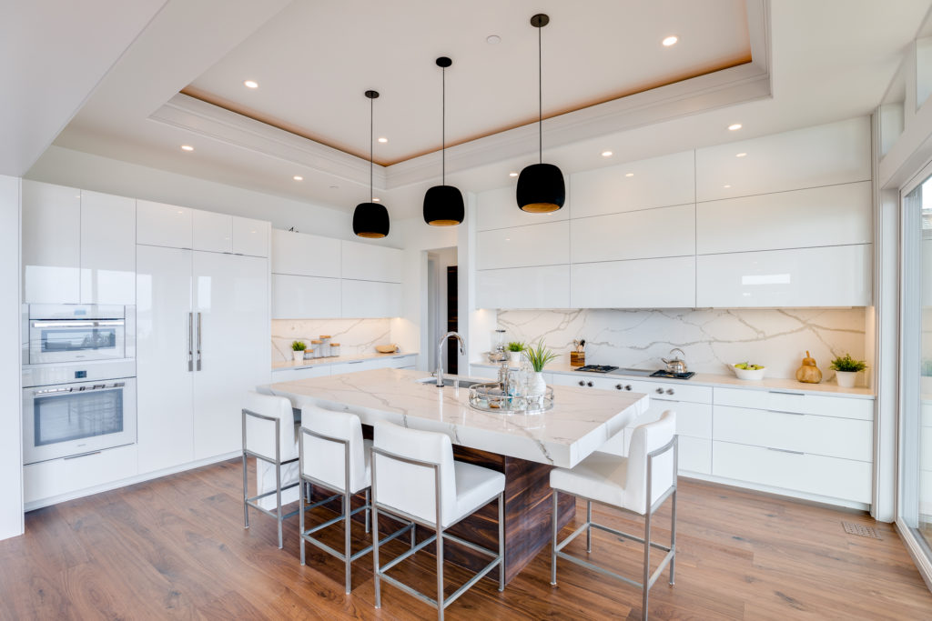 Custom luxury kitchen with large island and breakfast bar stool seating