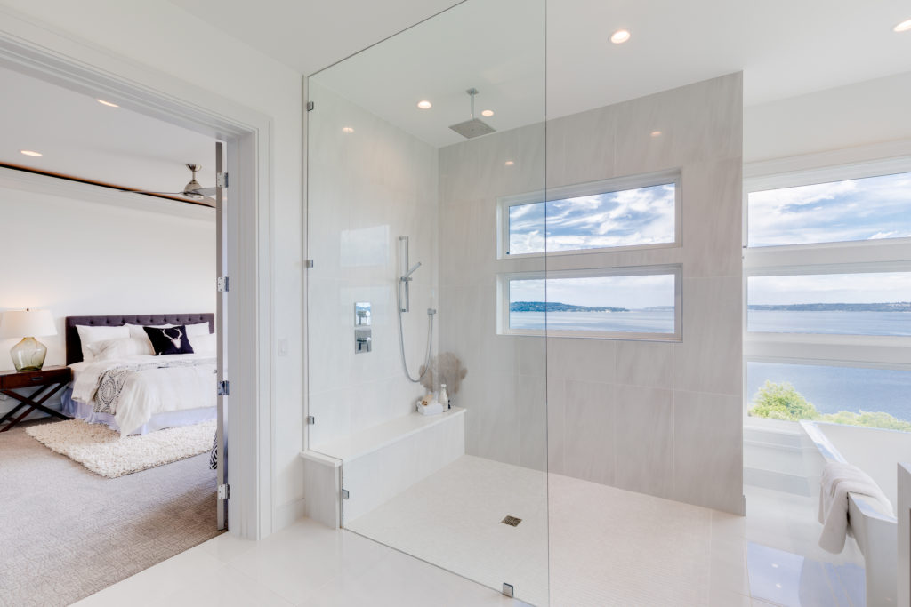 Large luxury bathroom with tub and 180 window view